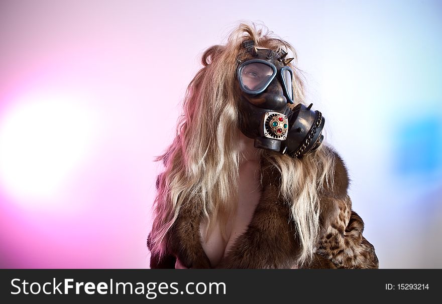 Young woman in the gas mask