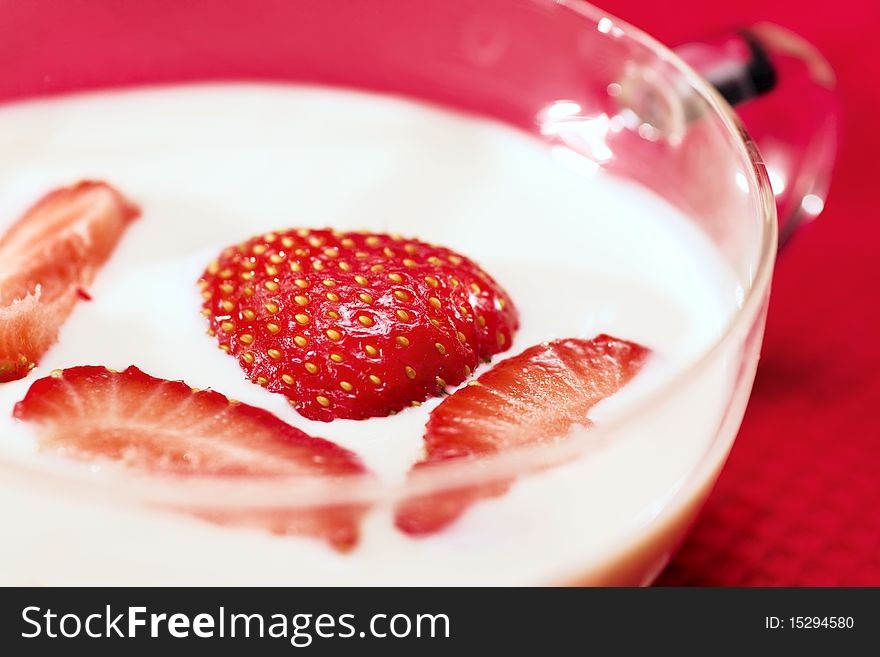 Fresh red strawberries in milk