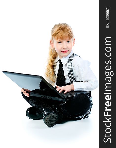 Shot of a little girl sitting on a floor with her laptop. Isolated over white background. Shot of a little girl sitting on a floor with her laptop. Isolated over white background.