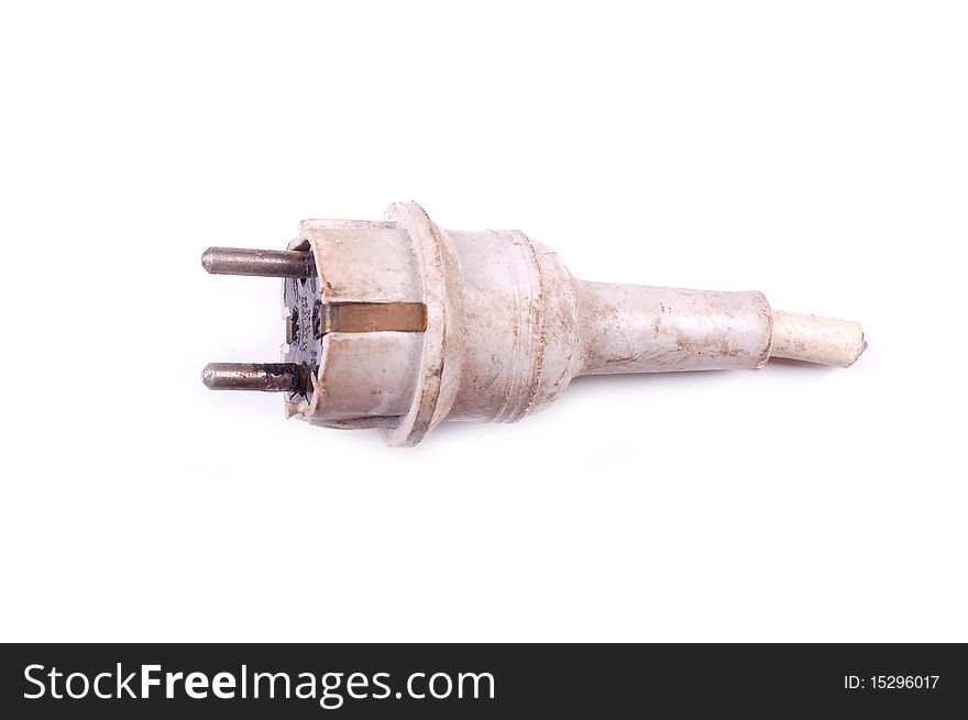 Used old power plug, signs of high temperature, not save for usage. the plug is isolated on white background. Used old power plug, signs of high temperature, not save for usage. the plug is isolated on white background.