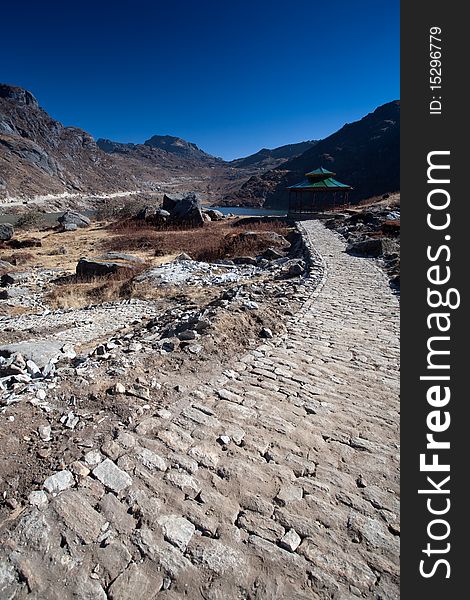 A rocky mountain path leading to some hills in Tsomgo Lake, in Sikkim, India. A rocky mountain path leading to some hills in Tsomgo Lake, in Sikkim, India.