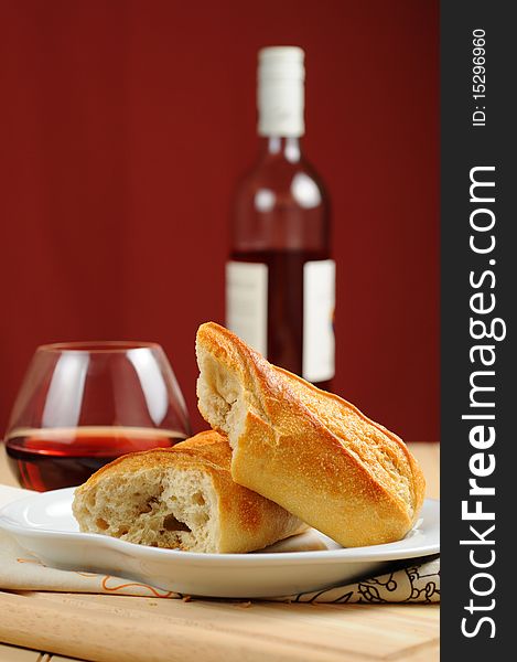 Fresh french bread served with red wine.