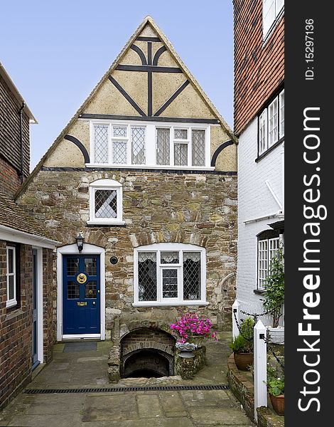 View of a quaint old house in England, with stairs leading down to a cellar. View of a quaint old house in England, with stairs leading down to a cellar