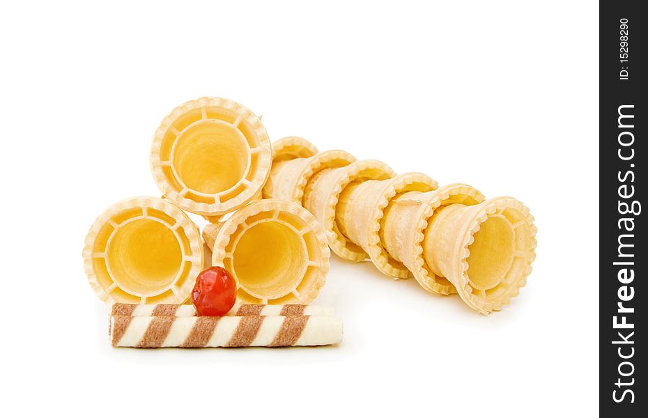 Empty ice cream cones with chocolate waffle and red cherry. Isolated over white background. Empty ice cream cones with chocolate waffle and red cherry. Isolated over white background.