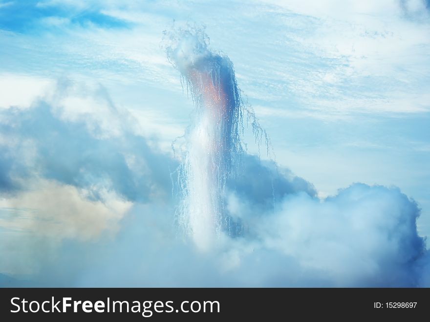 A pillar of smoke and sparks, growing out of the clouds. A pillar of smoke and sparks, growing out of the clouds