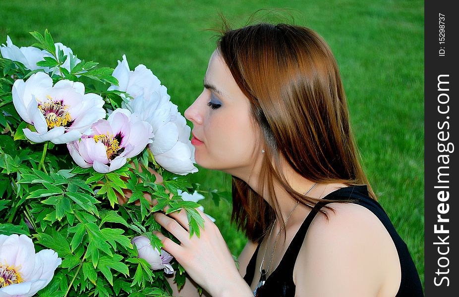 Girl Is Smelling Flowers