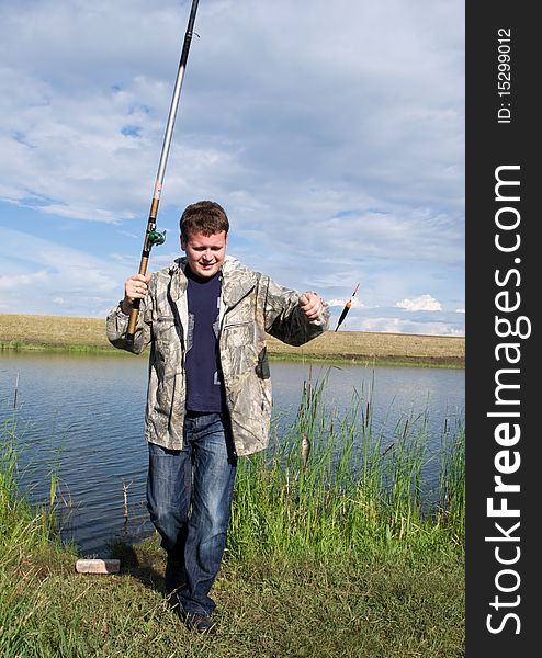 A fisherman collects a fishing-rod for fishing. A fisherman collects a fishing-rod for fishing