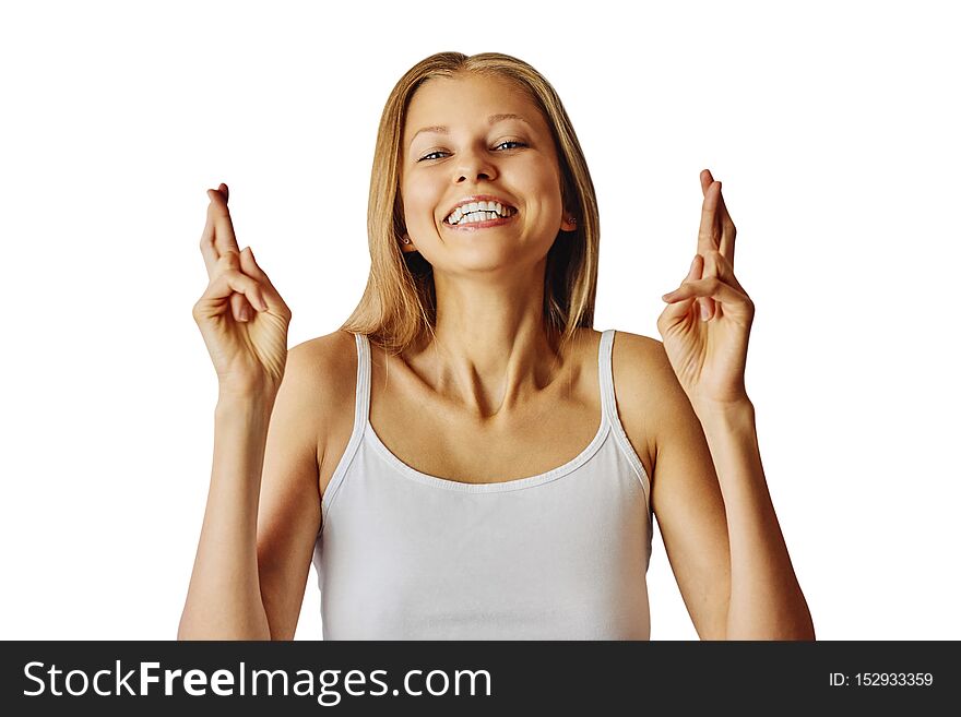 Happy smiling woman keeps fingers crossed and wishes for a good luck