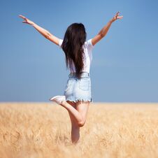 Happy Woman Enjoying The Life In The Field Nature Beauty, Blue Sky And Field With Golden Wheat. Outdoor Lifestyle. Freedom Concept Royalty Free Stock Images