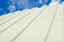 Corrugated Iron Roof Against Cloudy Sky Stock Images