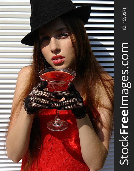 Outdoor stylization. Mysterious girl with the drink. Outdoor stylization. Mysterious girl with the drink