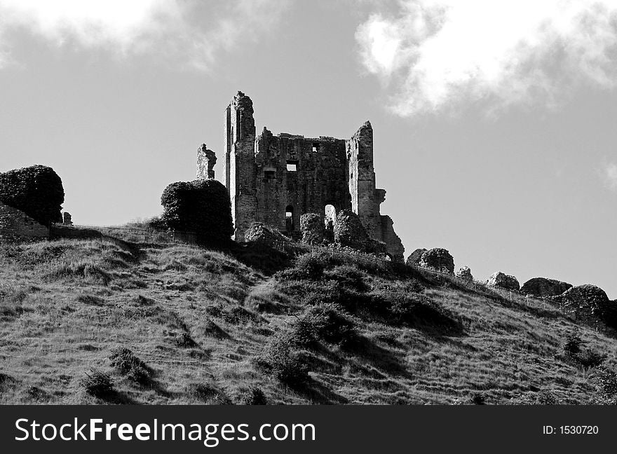 Crumbling Castle sat on top of a grassy hill. Crumbling Castle sat on top of a grassy hill