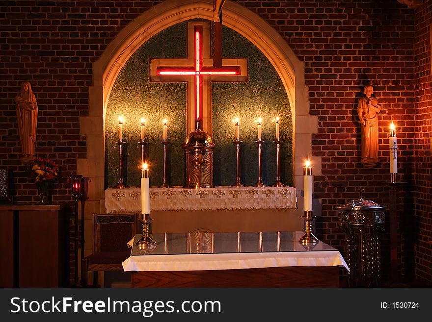 Small sanctuary lit with candles. Small sanctuary lit with candles