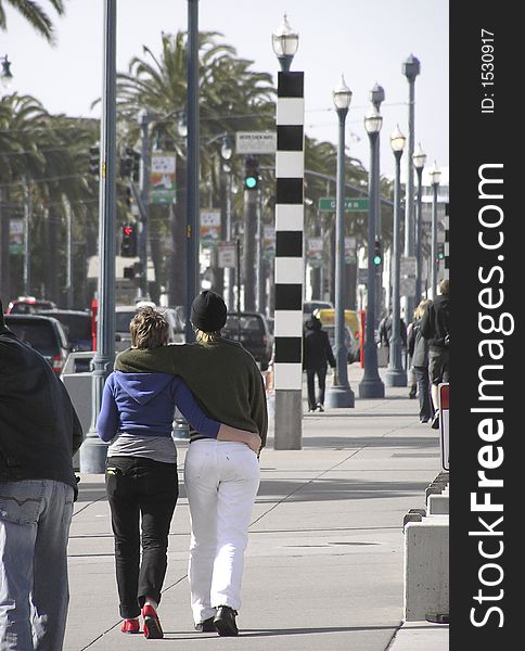 Couple loving, cuddling walk on the sunny street of San Francisco