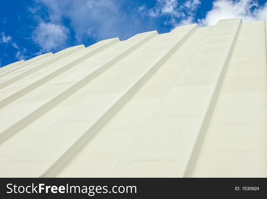 Corrugated Iron Roof Against Cloudy Sky