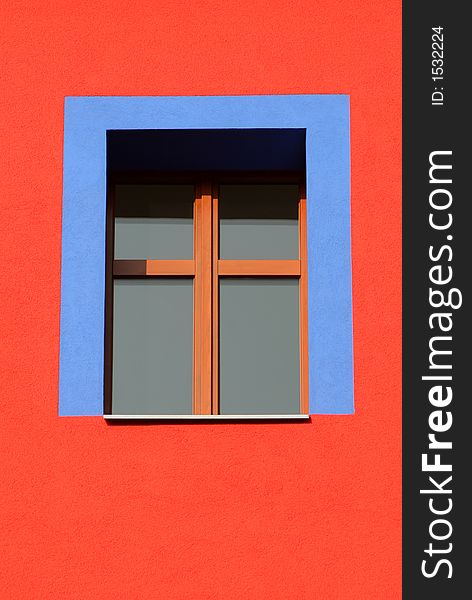 Bare blue window on red house