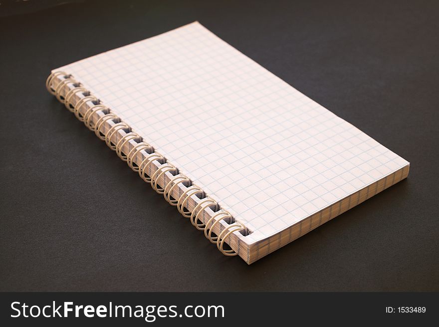 Open scrapbook, notepad, notebook on black paper. Open scrapbook, notepad, notebook on black paper
