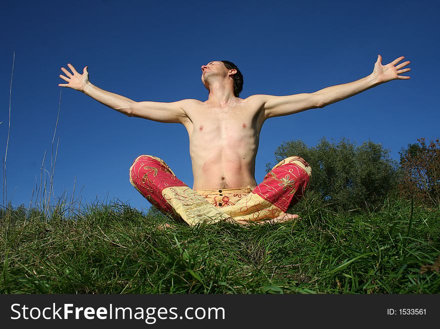 Man experiencing bliss on a blue summer sky