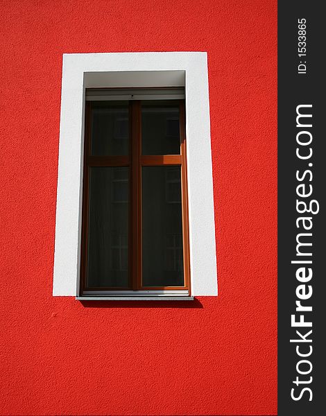 White window frame on red wall