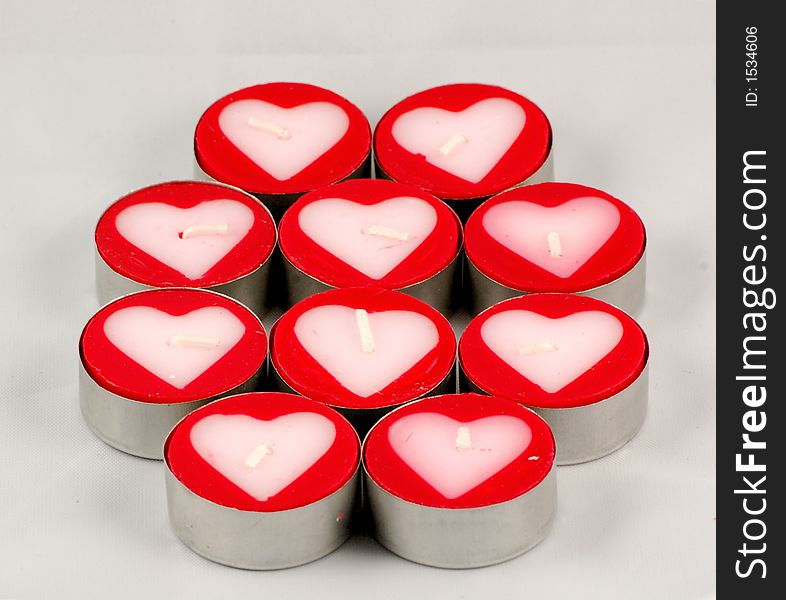 Ten red candles with white hearts in the middle. Ten red candles with white hearts in the middle