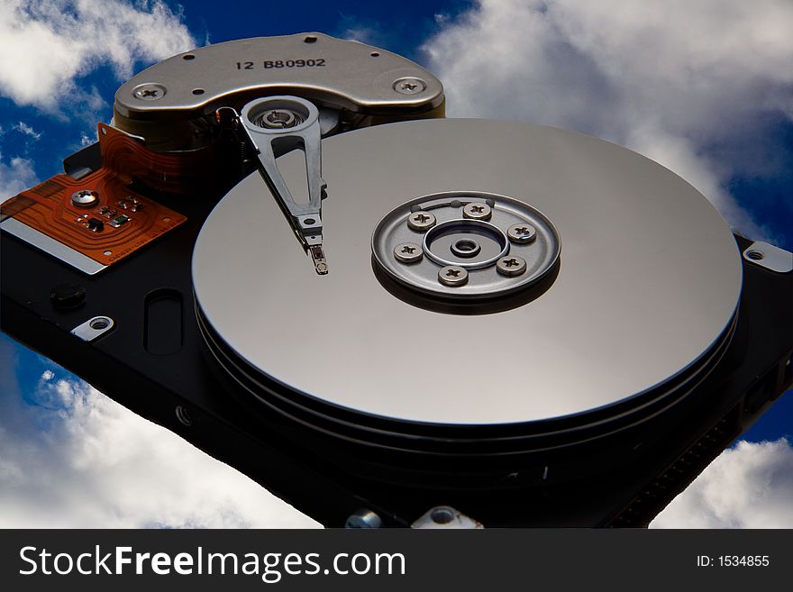 A multi-platter disk drive with the sky as a background. A multi-platter disk drive with the sky as a background.