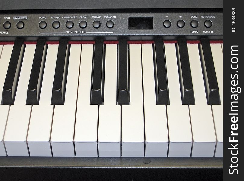 Close-Up of Electronic Piano Keyboard and Controls