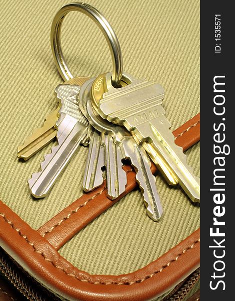 This is a close up image of a set of keys on a padfolio. This is a close up image of a set of keys on a padfolio.