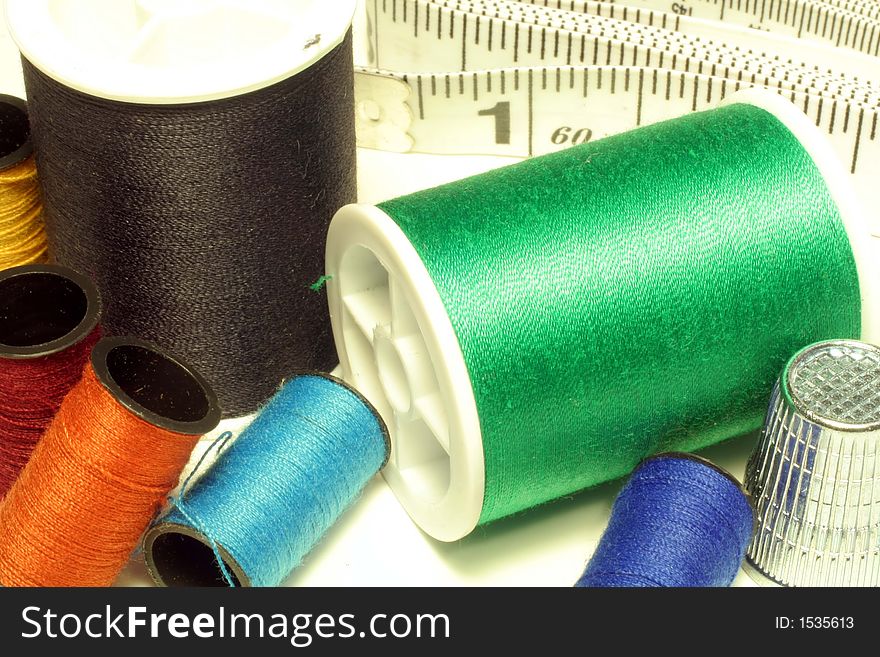 Spools Of Thread, Thimble, And Tape Measure
