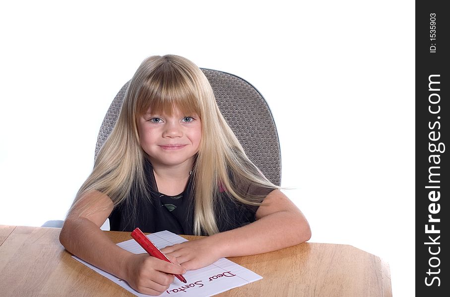 Young girl writing letter to Santa. Young girl writing letter to Santa