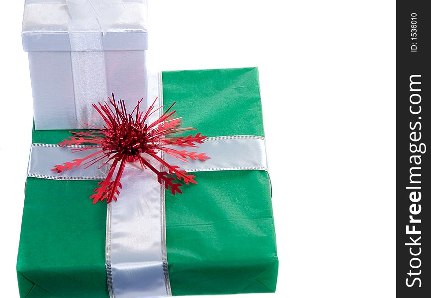 Green and white gifts wrapped with red bow. Green and white gifts wrapped with red bow
