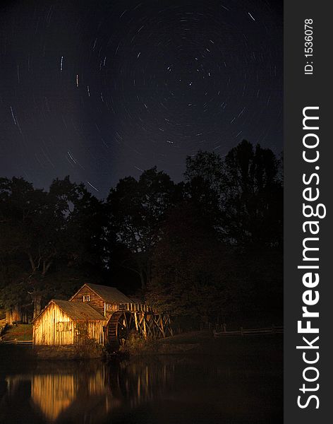 Star trails over an illuminated Marby mill along the Blue Ridge Parkway, Virginia. Star trails over an illuminated Marby mill along the Blue Ridge Parkway, Virginia