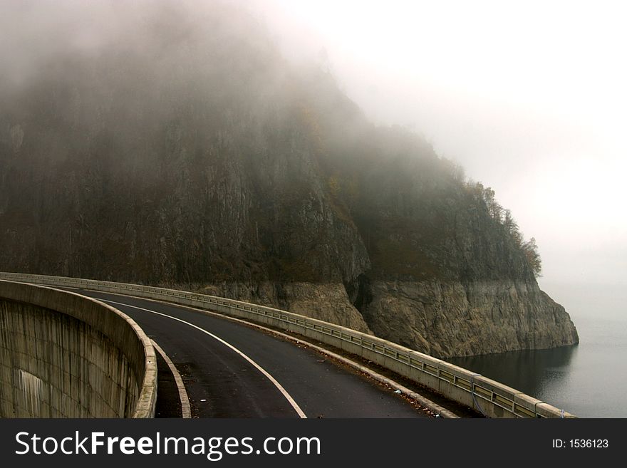 Mist road over Vidraru Dam - Romania, 166 m hight, 465 millions mc, build in 1966