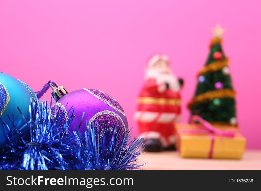 Christmas Ornaments on Pink Background. Shallow DOF