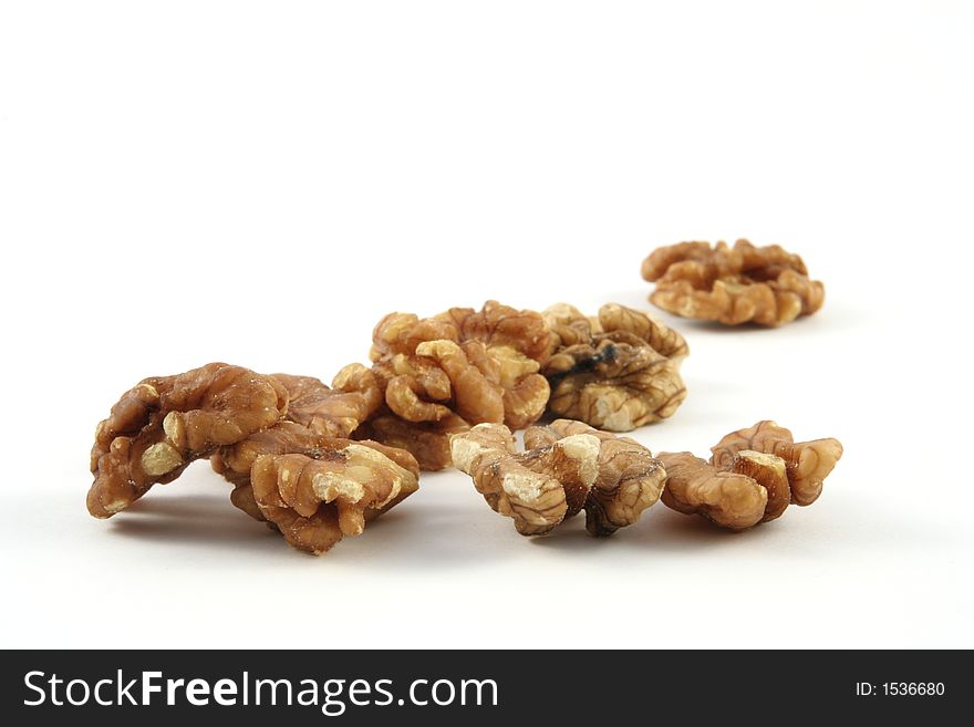 Walnuts against a white background