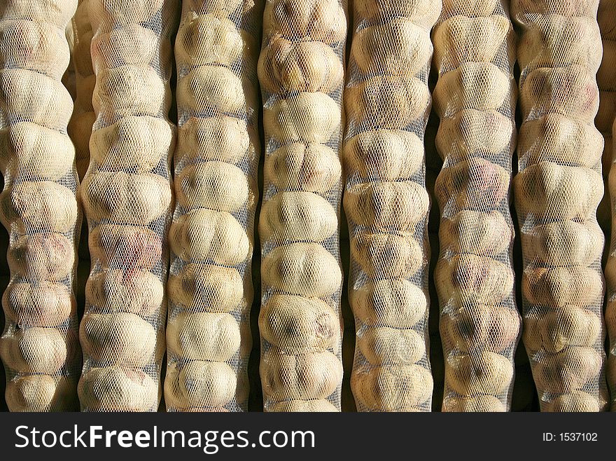 Garlic bags in vertical columns
