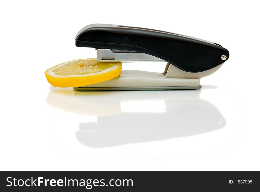 Stapler with citron on isolated white background