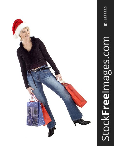 Young female posing with christmas bags on white. Young female posing with christmas bags on white