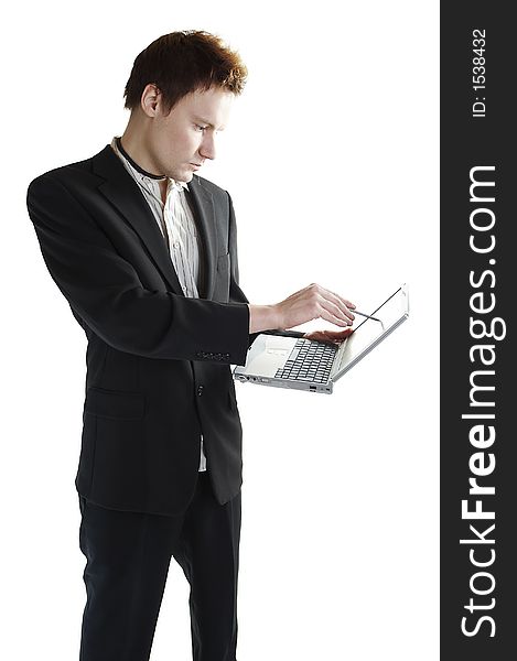 Isolated young businessman using a touchscreen laptop. Isolated young businessman using a touchscreen laptop