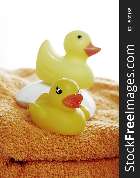 Yellow rubber duckies and a bar of soap