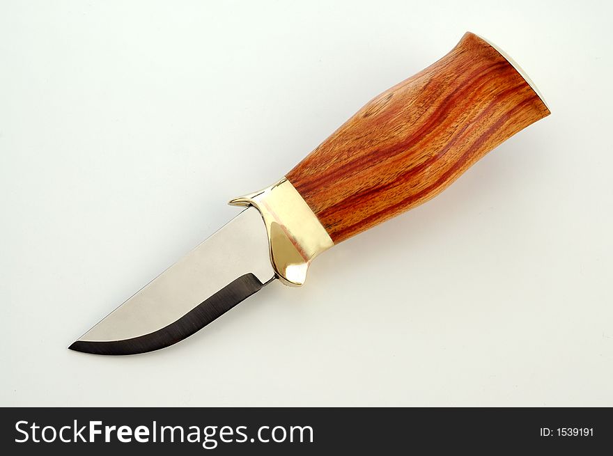 A hand made knife with rosewood handle. A hand made knife with rosewood handle