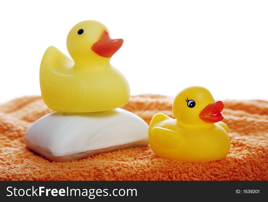 Yellow rubber duckies and a bar of soap
