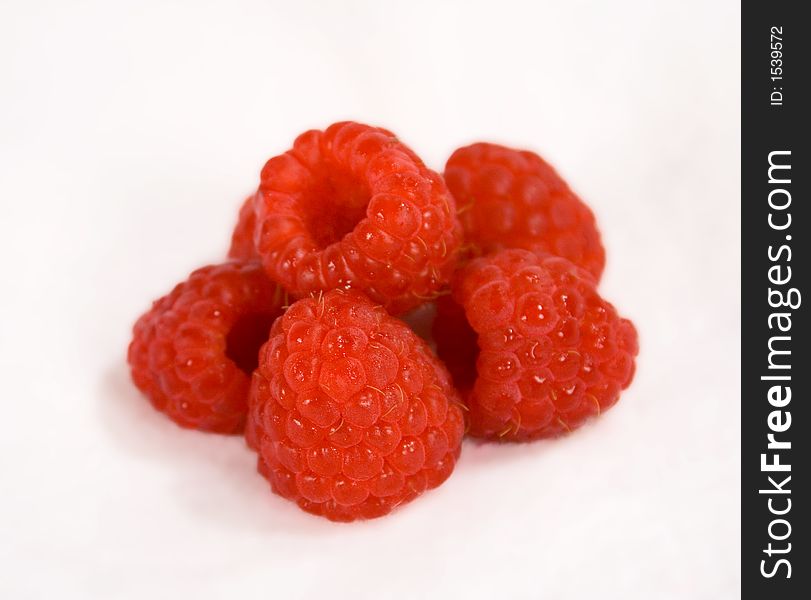 Close up of fresh raspberries isolated on white