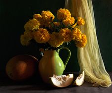 Still Life With Marigolds And Melon Royalty Free Stock Images