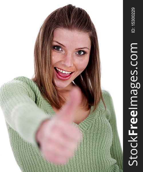 Smiling beautiful girl showing her thumps up over white background