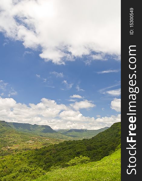 Lush green mountains and clouds