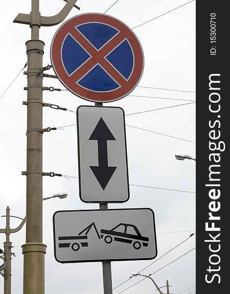 The traffic sign forbidding a stop and parking for which infringement there will be a car evacuation. The traffic sign forbidding a stop and parking for which infringement there will be a car evacuation