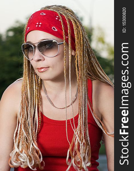Late teenage girl with braids posing outdoors. Late teenage girl with braids posing outdoors