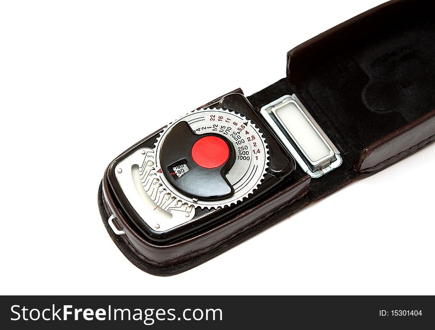 Vintage light meter isolated on white background.