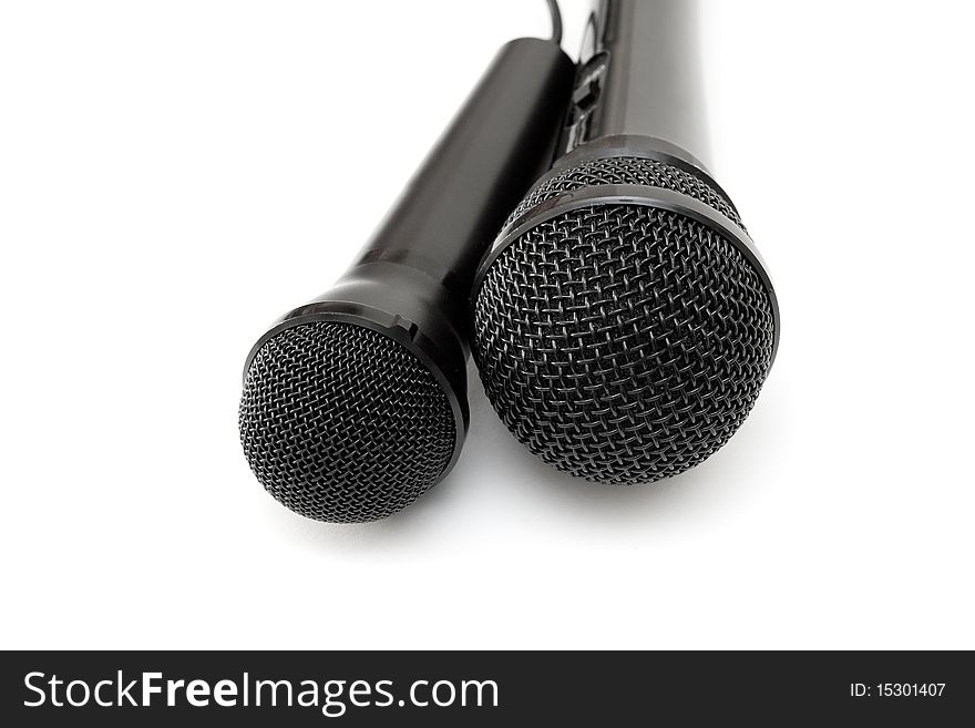 Two black microphones isolated on a white background.