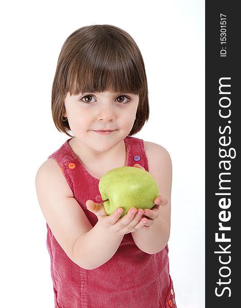 Three years old girl, holding an apple, smiling at the camera. Studio shot, professionally retouched. Three years old girl, holding an apple, smiling at the camera. Studio shot, professionally retouched.